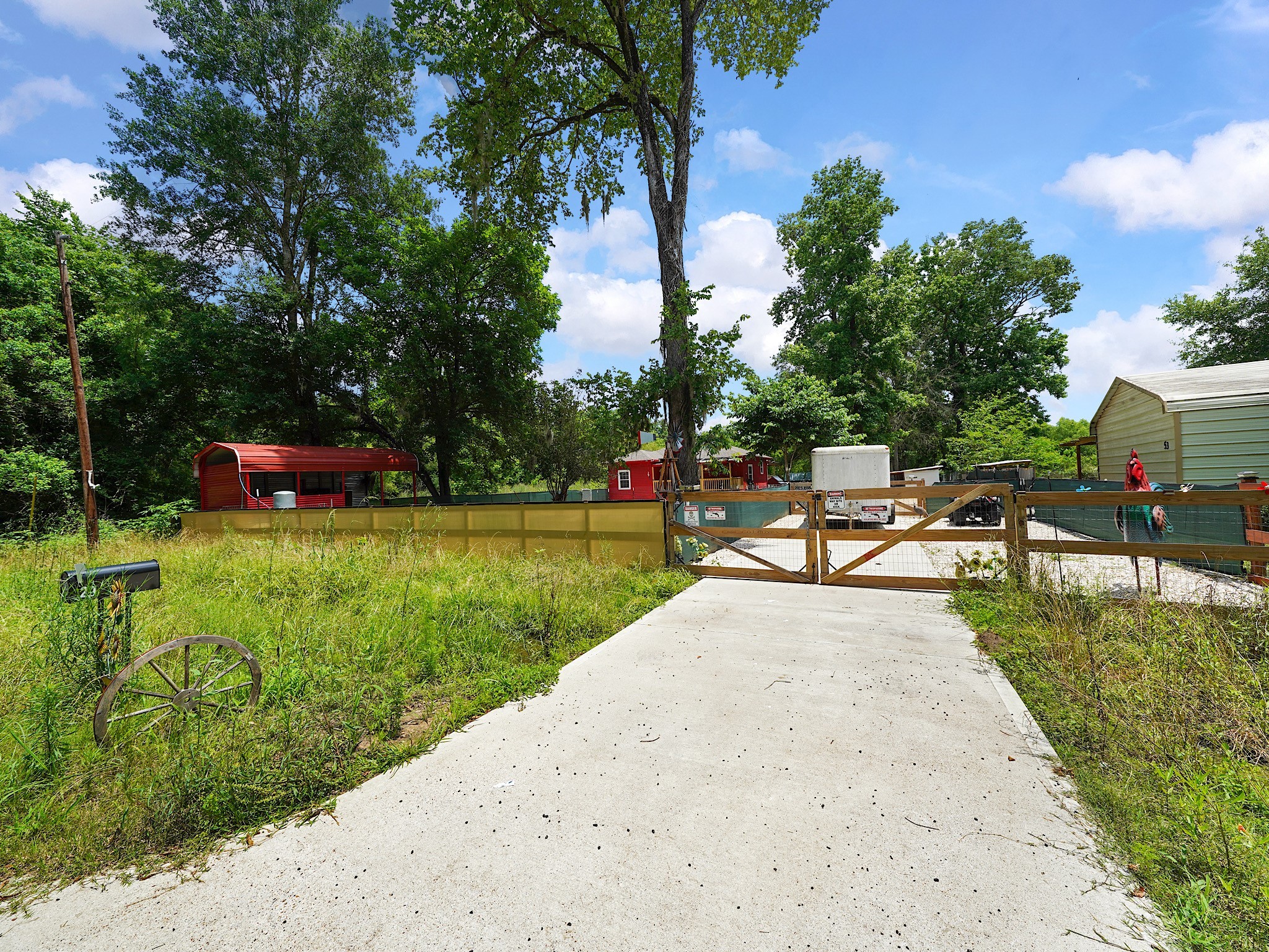 29 County Road 2131, Unit A Cleveland, TX 77327 - Photo 5 of 24 a green field with trees in the background