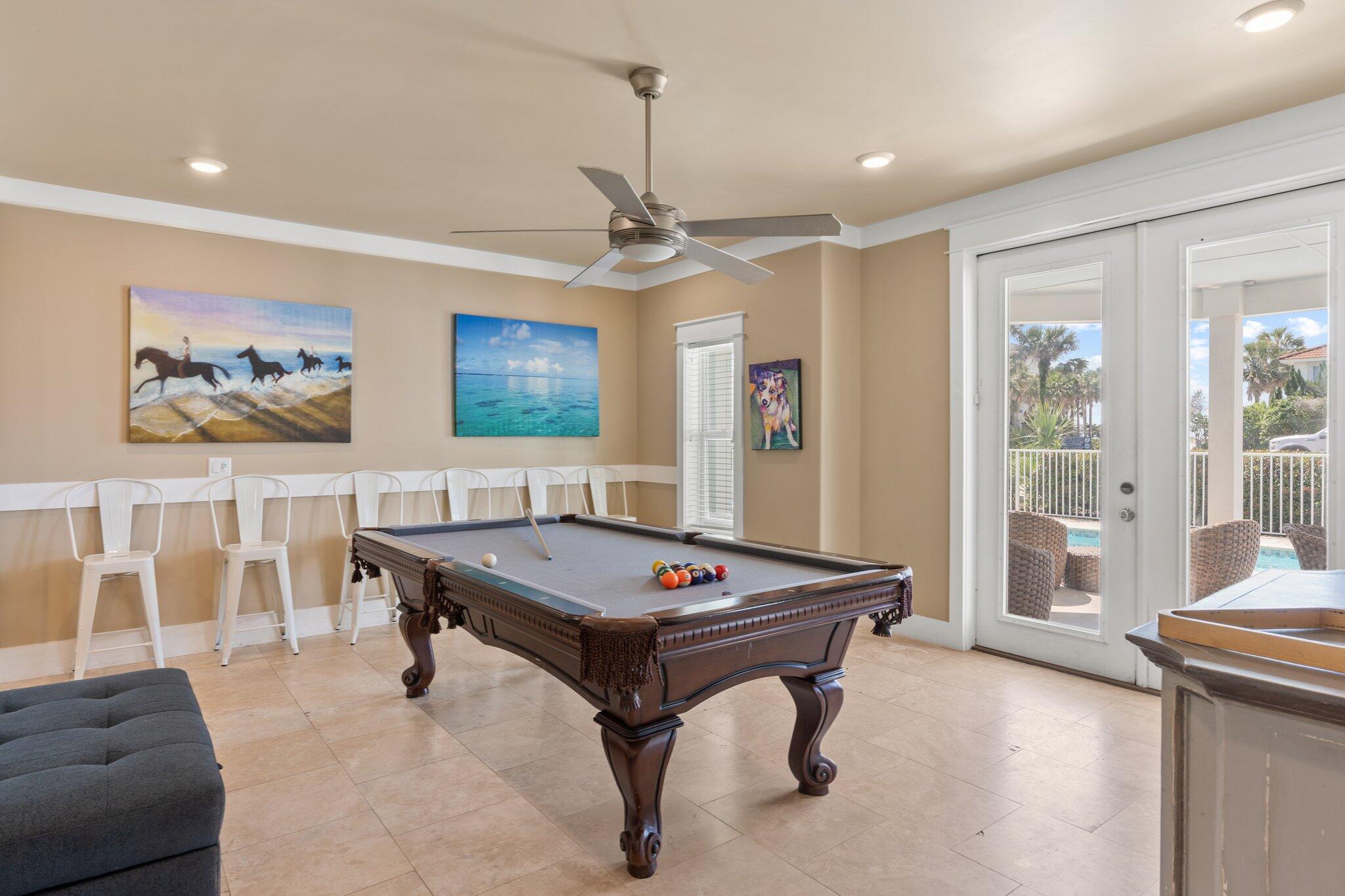 4478 Ocean View Drive Destin, FL 32541 - Photo 12 of 122 a living room with furniture a table and a flat screen tv