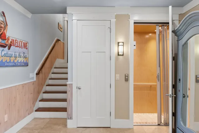 a living room with furniture fireplace and a large window
