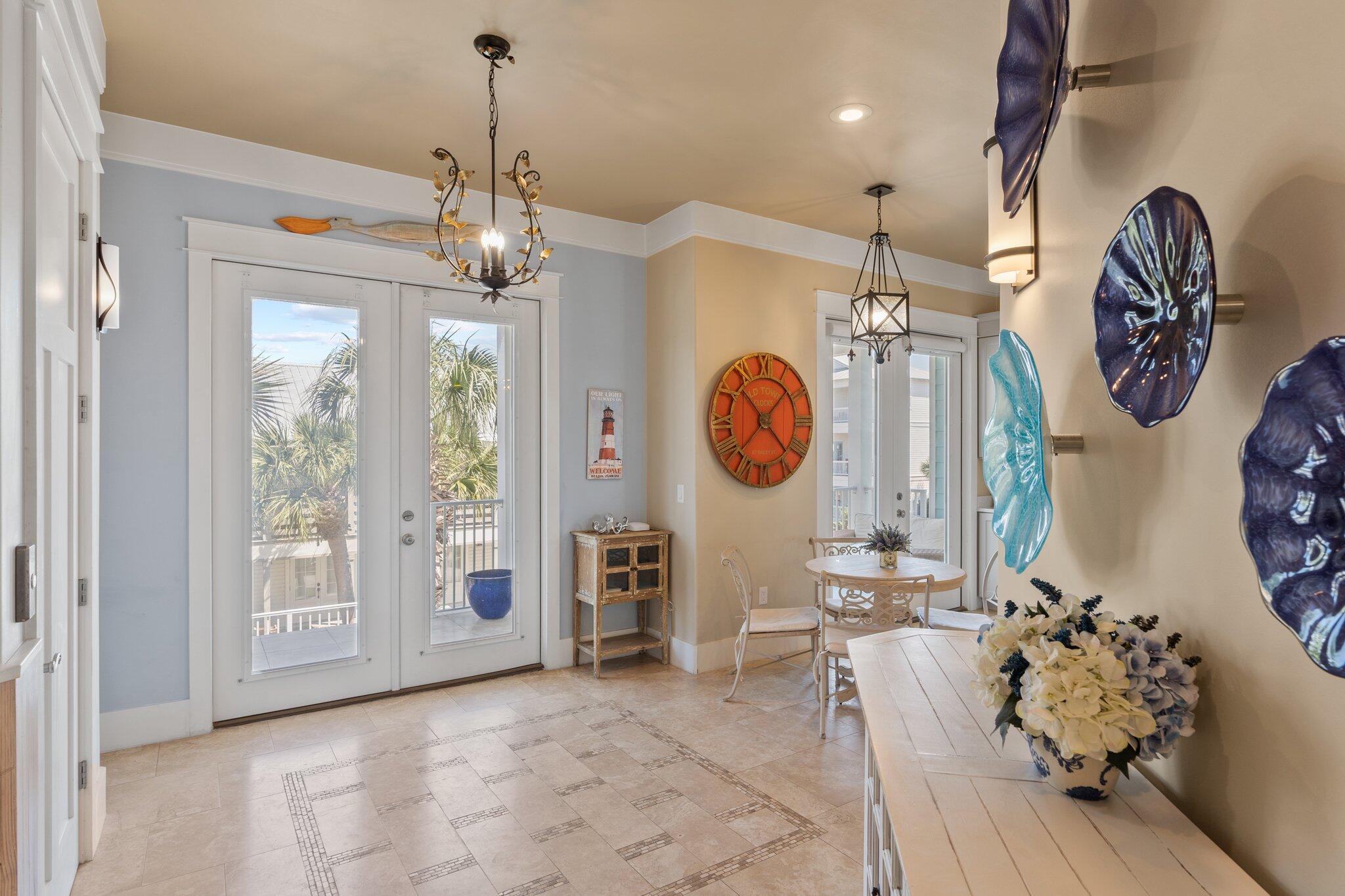 4478 Ocean View Drive Destin, FL 32541 - Photo 23 of 122 a view of a dining room with furniture wooden floor and chandelier