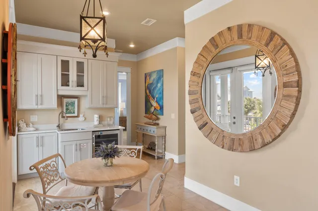 a living room with furniture and floor to ceiling windows