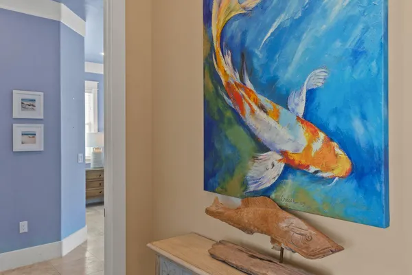 a living room with furniture and a large mirror