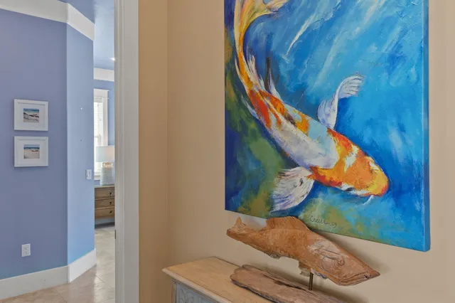 a living room with furniture and a large mirror