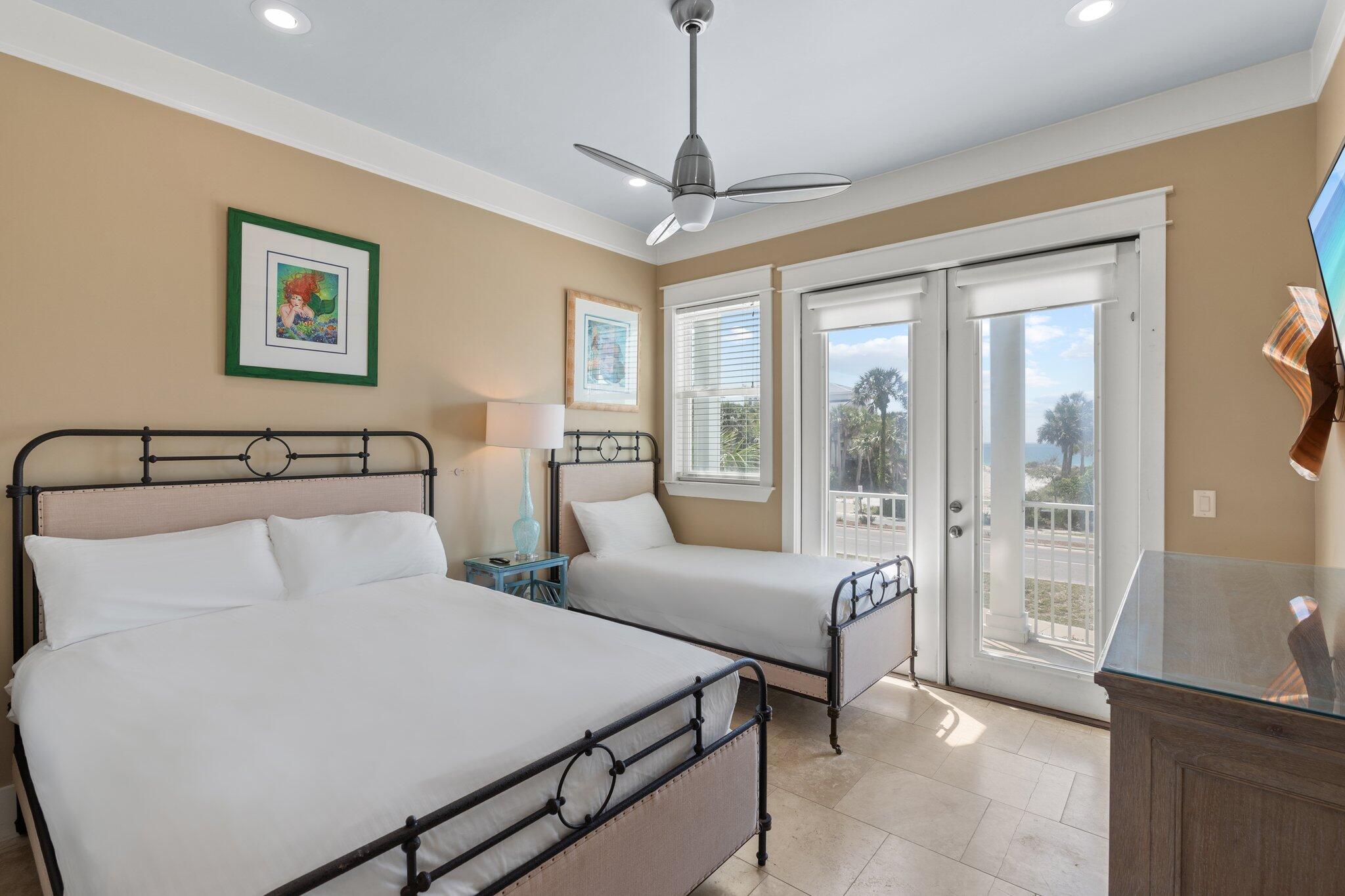 4478 Ocean View Drive Destin, FL 32541 - Photo 36 of 122 a bedroom with a large bed and a chandelier