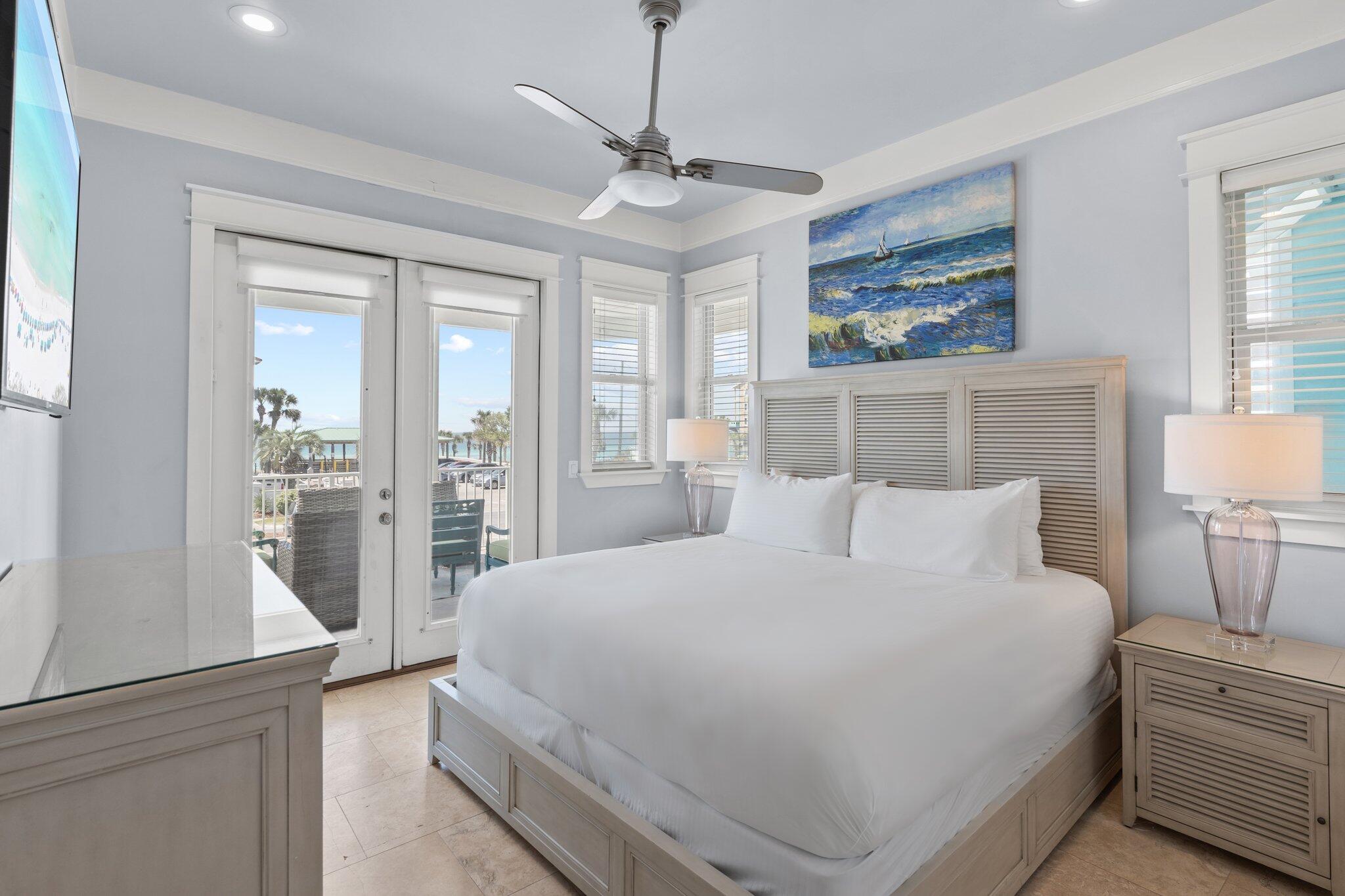 4478 Ocean View Drive Destin, FL 32541 - Photo 43 of 122 a bedroom with a large bed and a chandelier