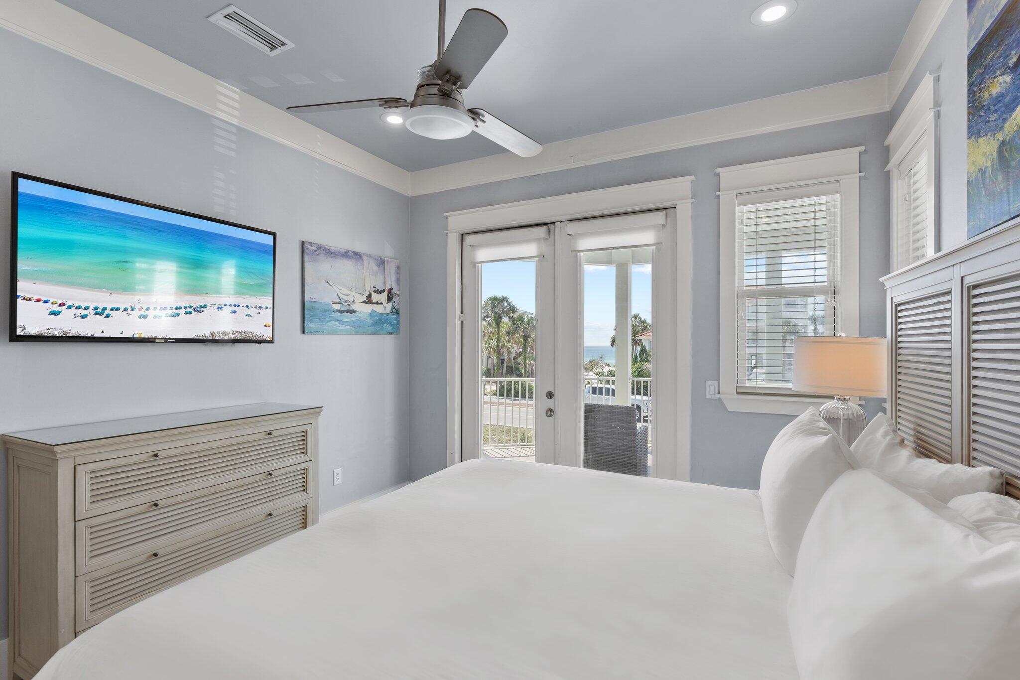 4478 Ocean View Drive Destin, FL 32541 - Photo 44 of 122 a bedroom with a large bed and a flat tv screen on dresser