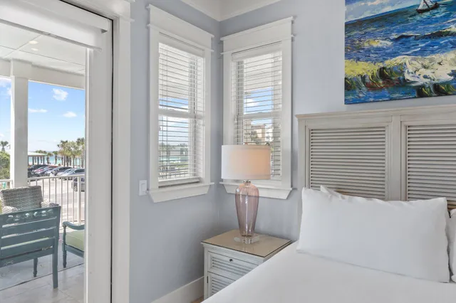 a view of a building with a yard and sitting area