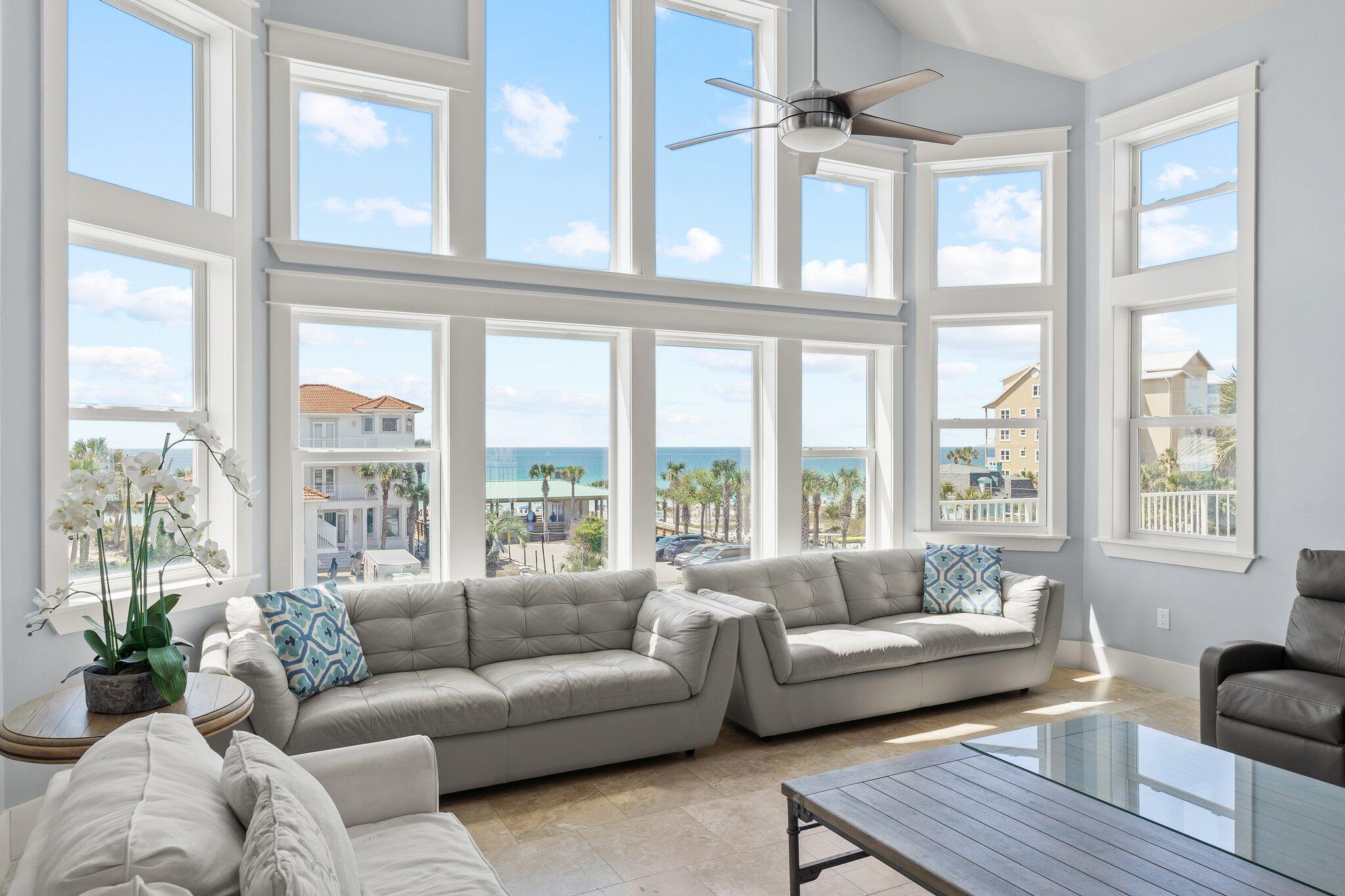 4478 Ocean View Drive Destin, FL 32541 - Photo 62 of 122 a living room with furniture and floor to ceiling windows