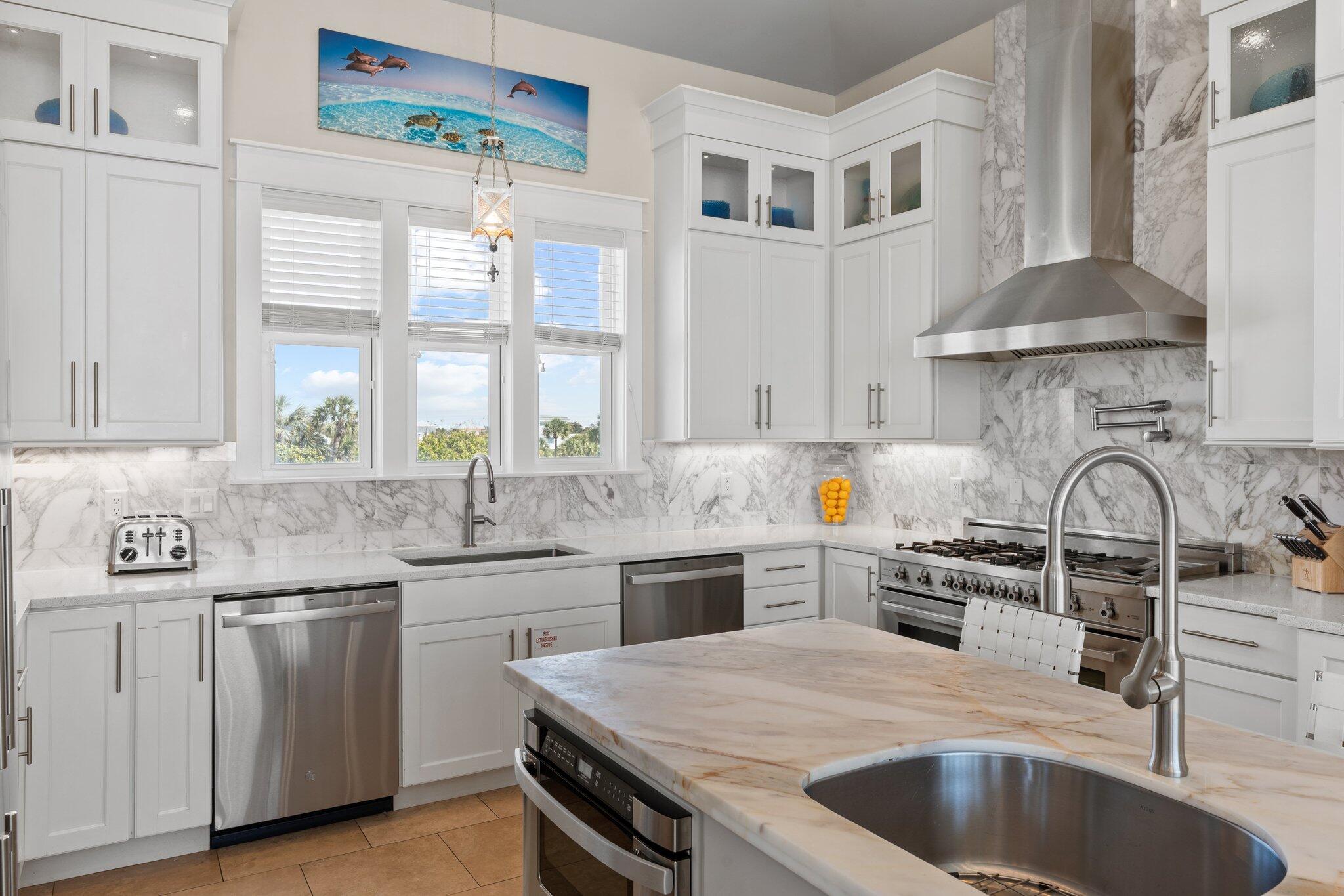 4478 Ocean View Drive Destin, FL 32541 - Photo 69 of 122 a kitchen with stainless steel appliances a sink a stove and cabinets