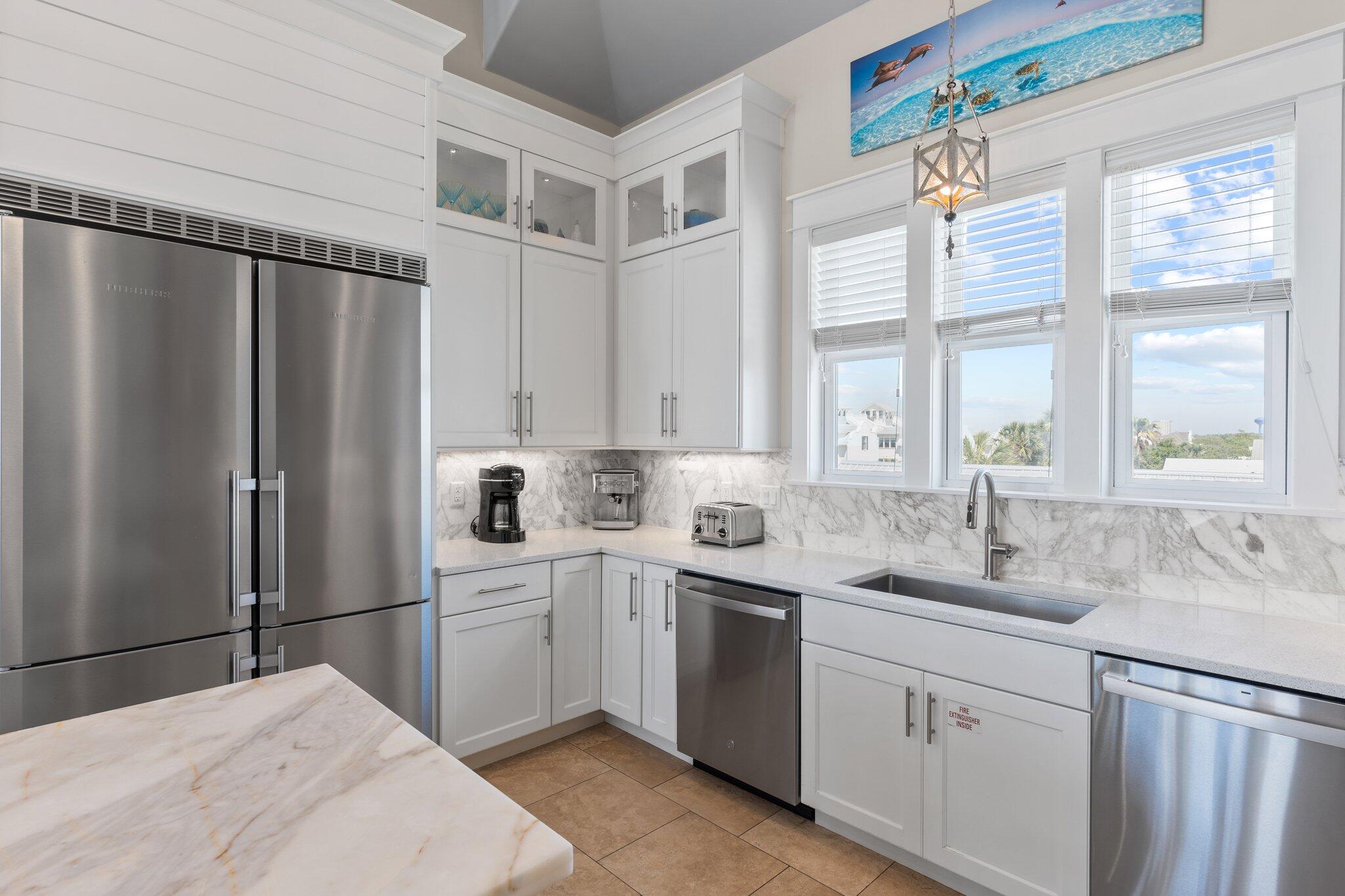 4478 Ocean View Drive Destin, FL 32541 - Photo 71 of 122 a kitchen with a sink stainless steel appliances cabinets and a window