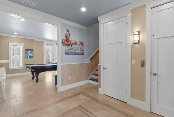 a bedroom with a large bed and a flat screen tv