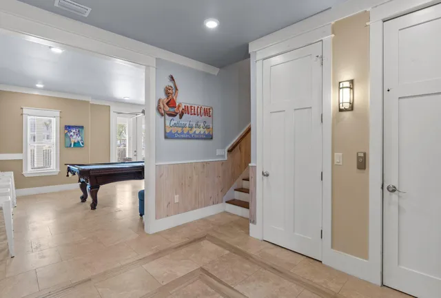 a bedroom with a large bed and a flat screen tv