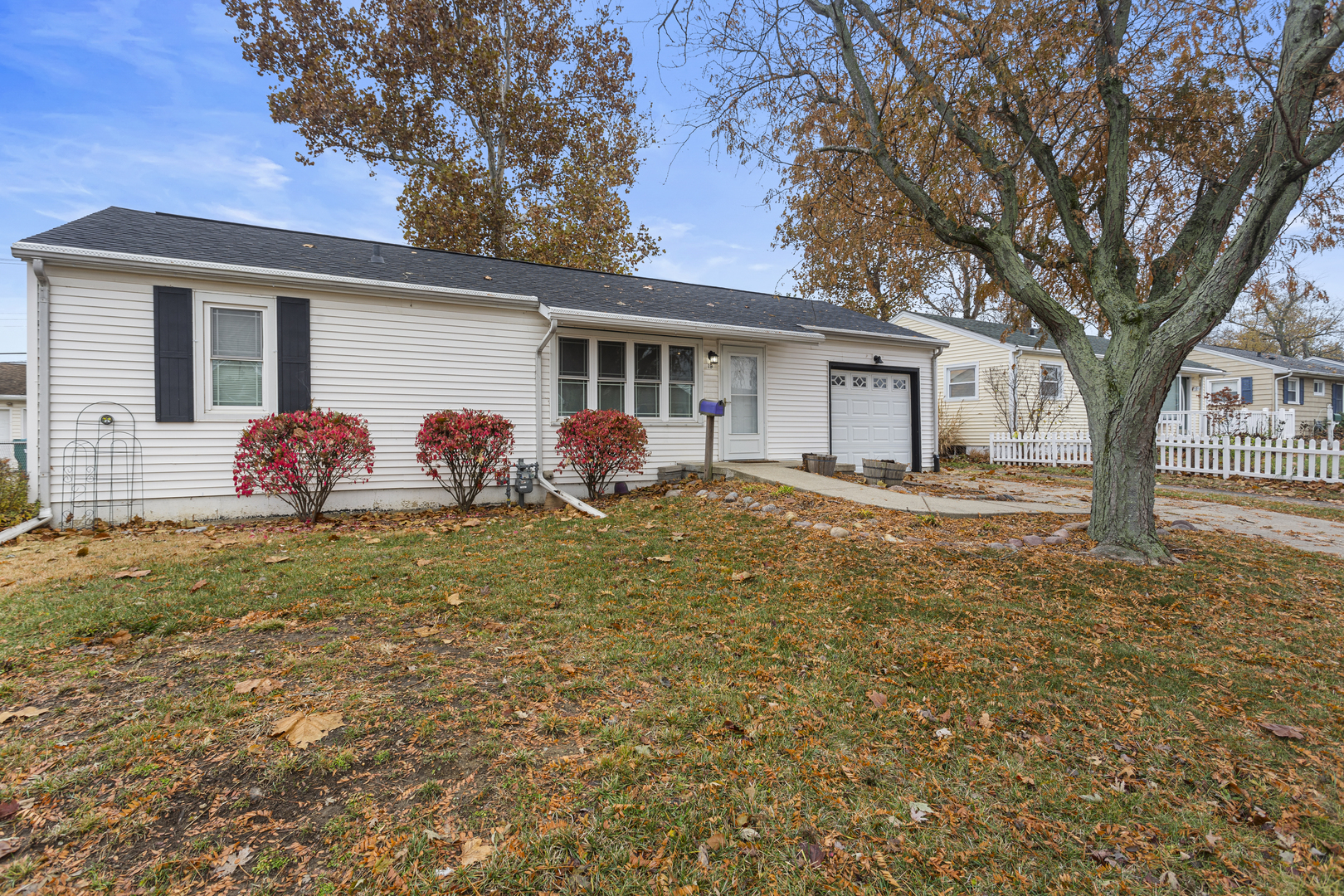 19 LaSalle Drive Decatur, IL 62521 - Photo 2 of 25 a front view of house with yard and trees around