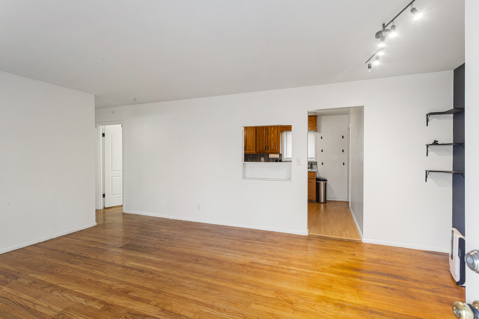 19 LaSalle Drive Decatur, IL 62521 - Photo 8 of 25 a view of a livingroom with wooden floor and a flat screen tv