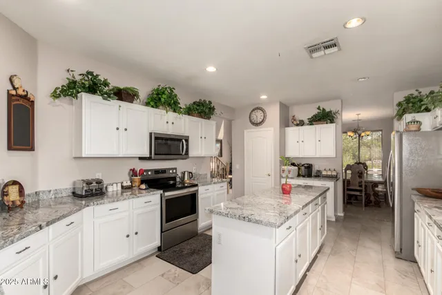 a kitchen with a sink stove and refrigerator