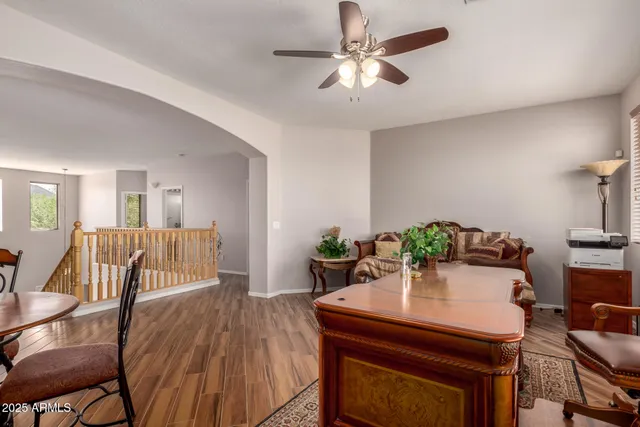 a view of a dining room with furniture and wooden floor