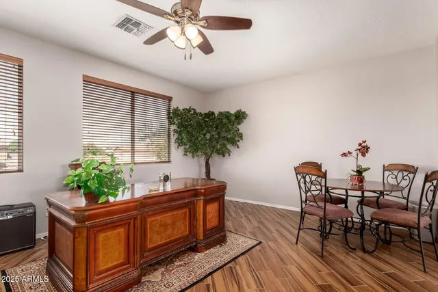 a view of a dining room with furniture window and wooden floor