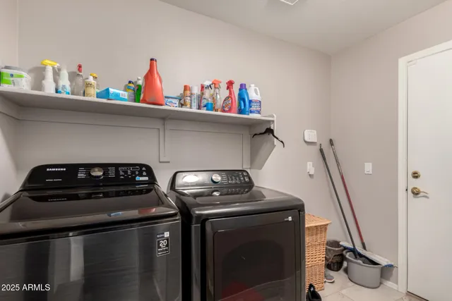 a utility room with dryer and washer
