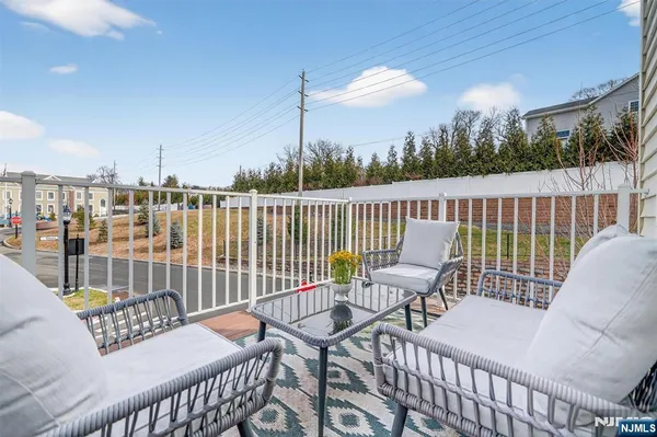 a view of balcony with furniture