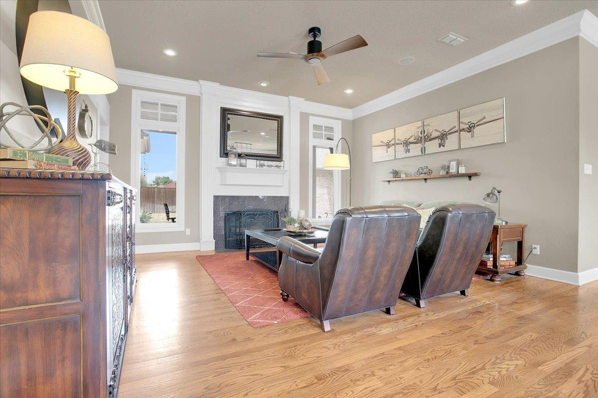 4818 104th Street Lubbock, TX 79424 - Photo 6 of 36 a view of a livingroom with furniture and a flat screen tv