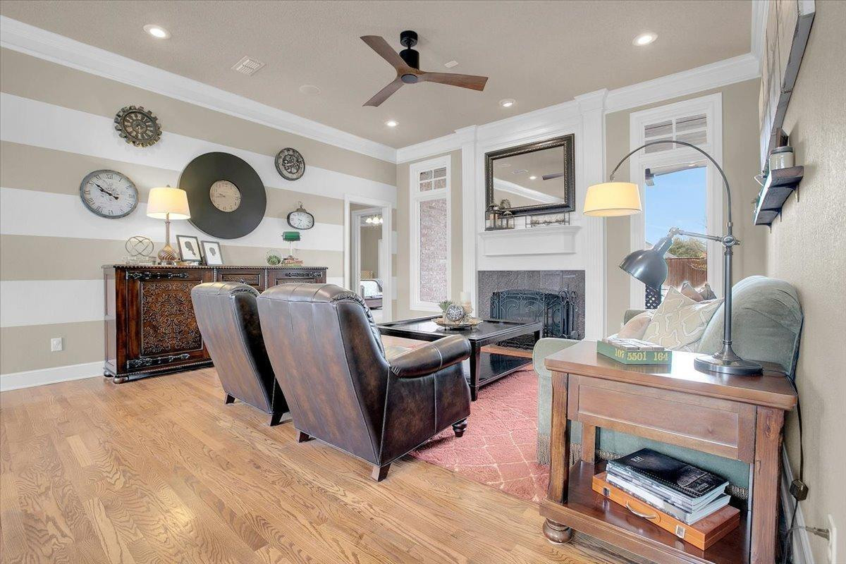 4818 104th Street Lubbock, TX 79424 - Photo 7 of 36 a living room with furniture and a fireplace