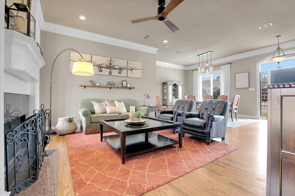 4818 104th Street Lubbock, TX 79424 - Photo 8 of 36 a living room with furniture a rug and white walls