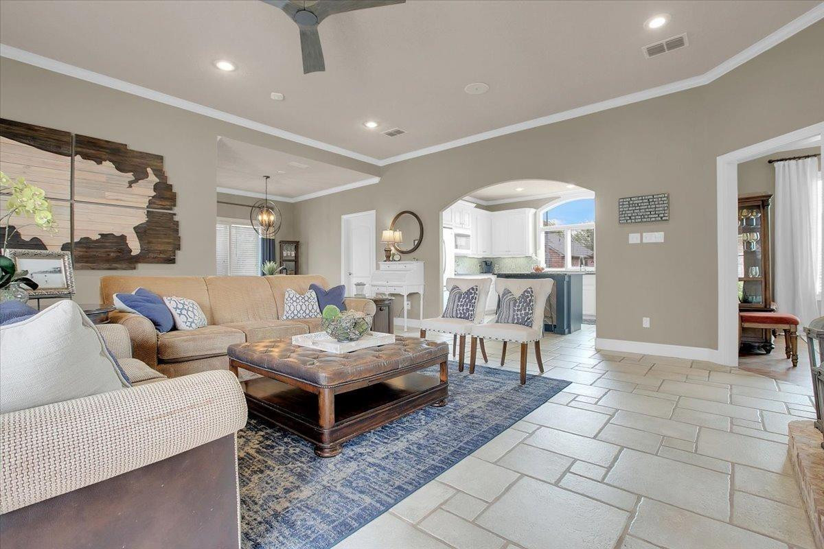 4818 104th Street Lubbock, TX 79424 - Photo 9 of 36 a living room with furniture and a large window