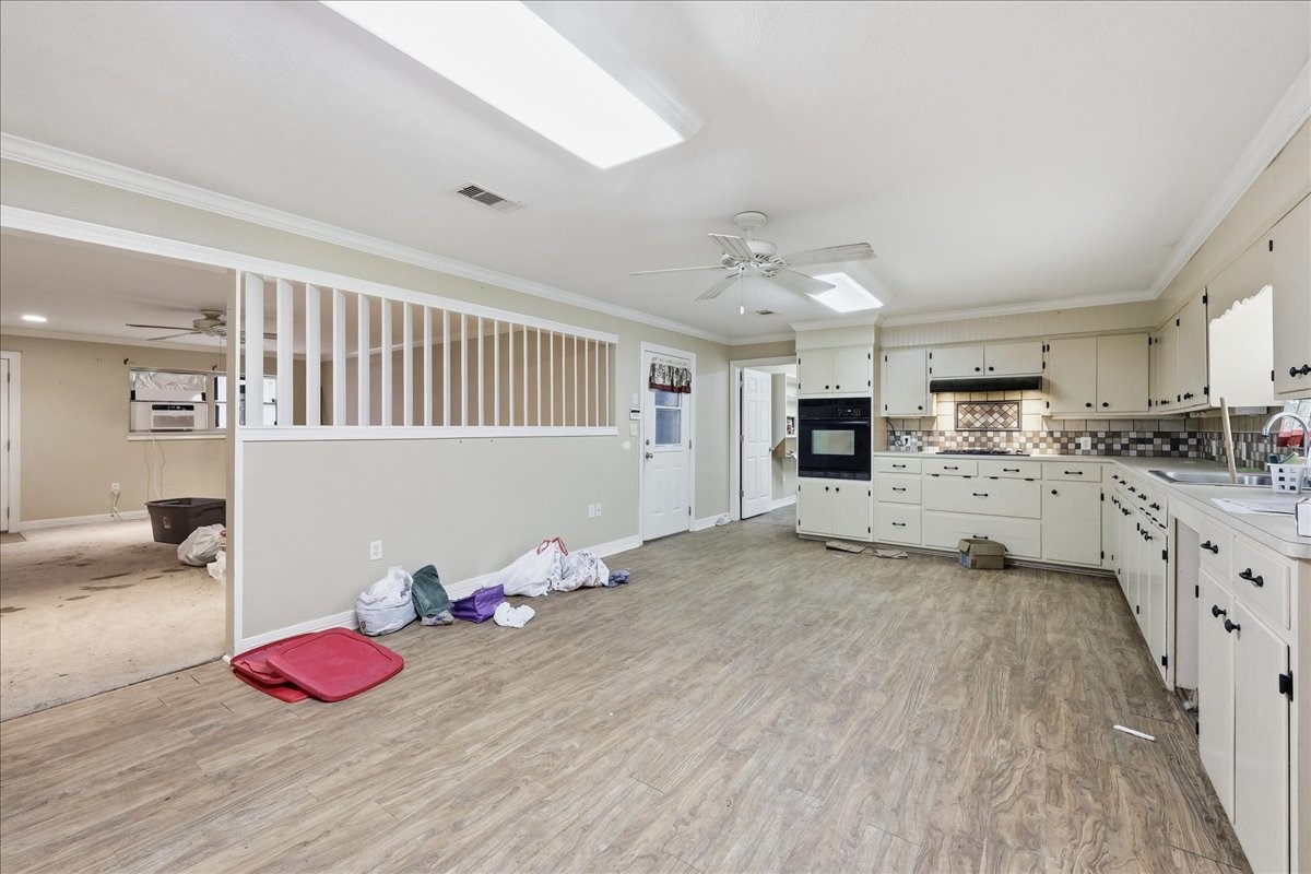 150 Gary Street Bridge City, TX 77611 - Photo 5 of 12 Additional interior living space with ceiling fans and natural light.