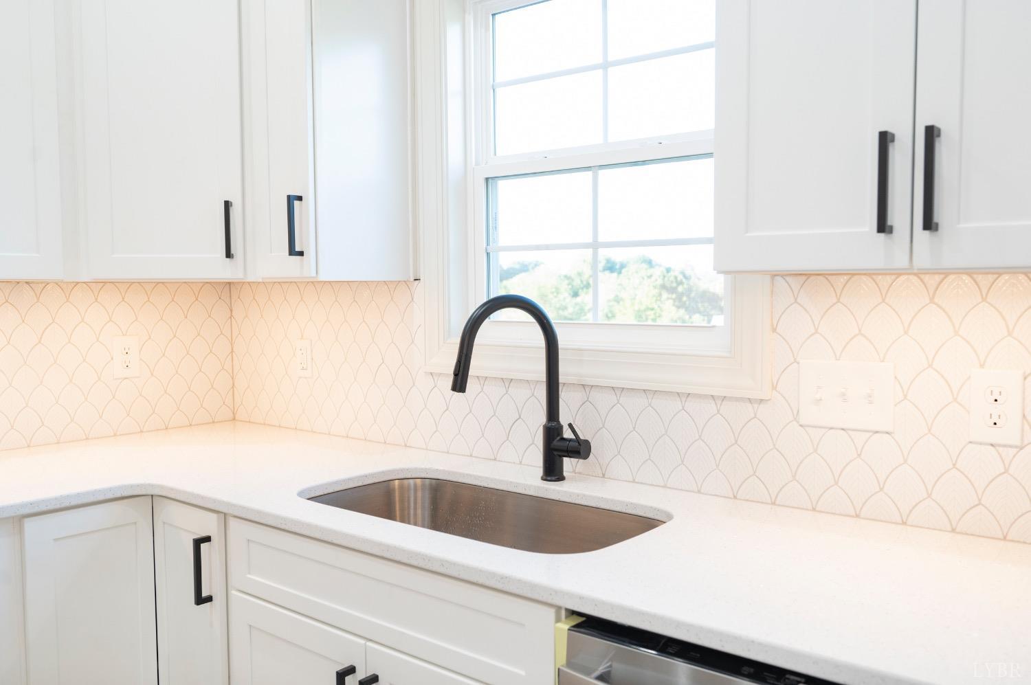 2329 Perrowville Road Forest, VA 24551 - Photo 21 of 54 Spacious kitchen with custom cabinets, tile backsplash, oversized island, stainless appliances and quartz countertops.