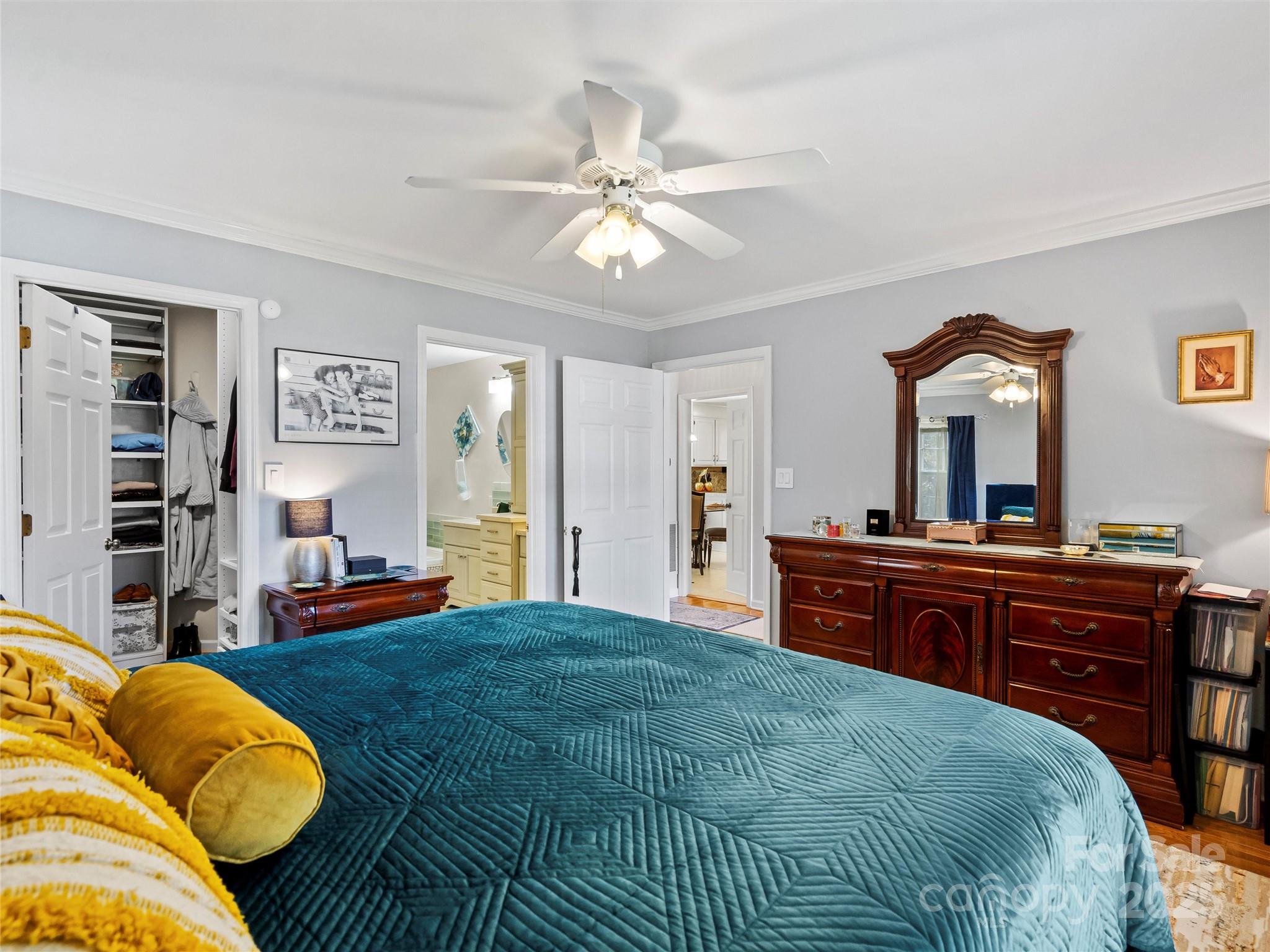 1002 4th Street Northeast Conover, NC 28613 - Photo 15 of 47 a bedroom with a bed and a mirror on dresser
