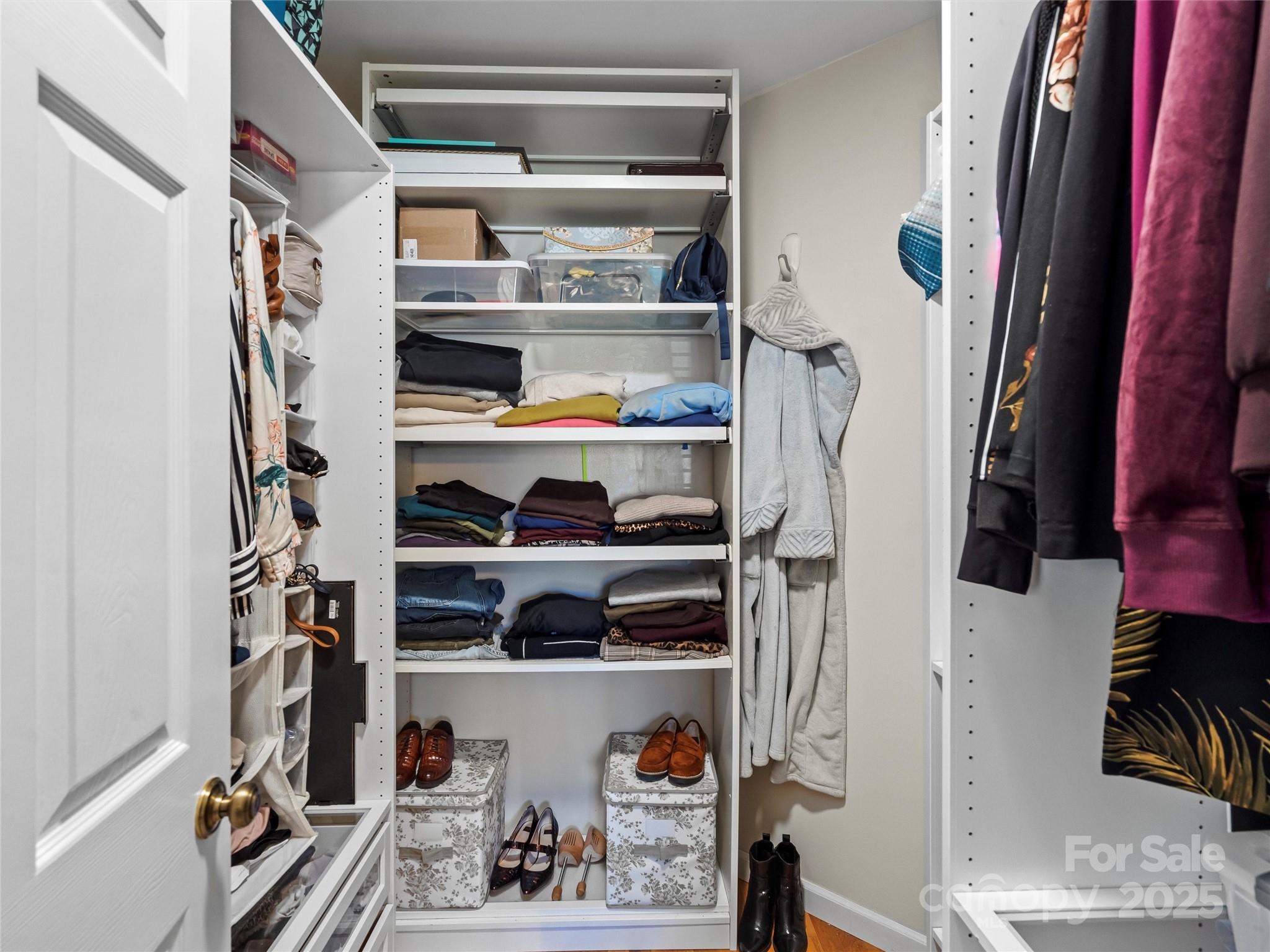 1002 4th Street Northeast Conover, NC 28613 - Photo 16 of 47 a view of walk in closet with clothes and shoes