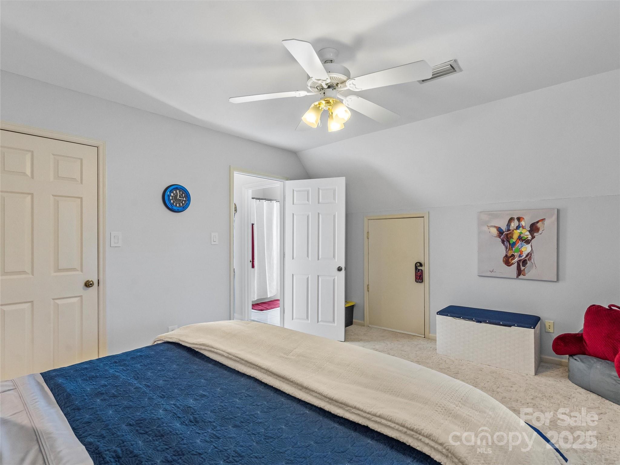 1002 4th Street Northeast Conover, NC 28613 - Photo 20 of 47 a bedroom with a bed and a chandelier