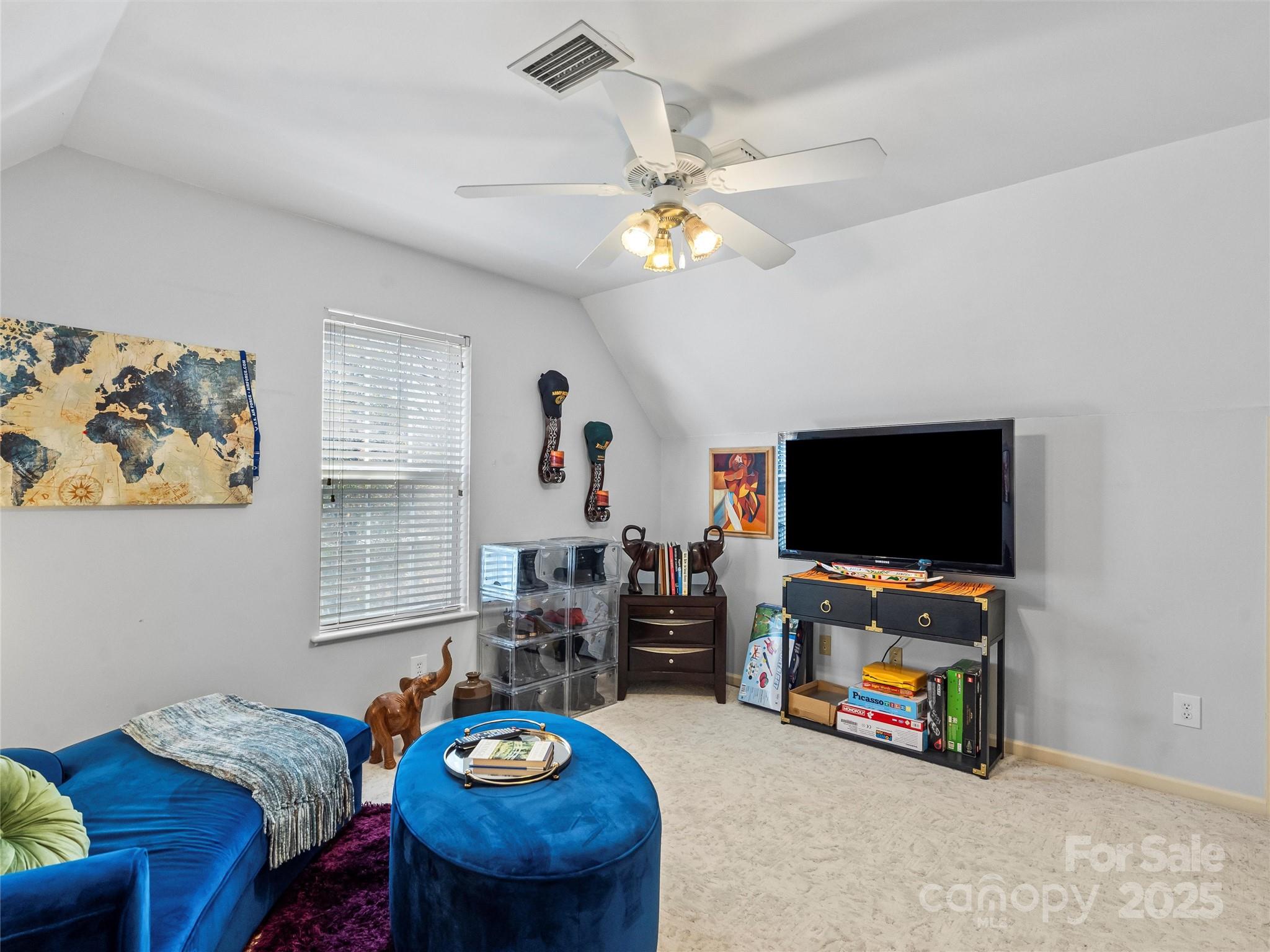 1002 4th Street Northeast Conover, NC 28613 - Photo 25 of 47 a living room with furniture and a flat screen tv