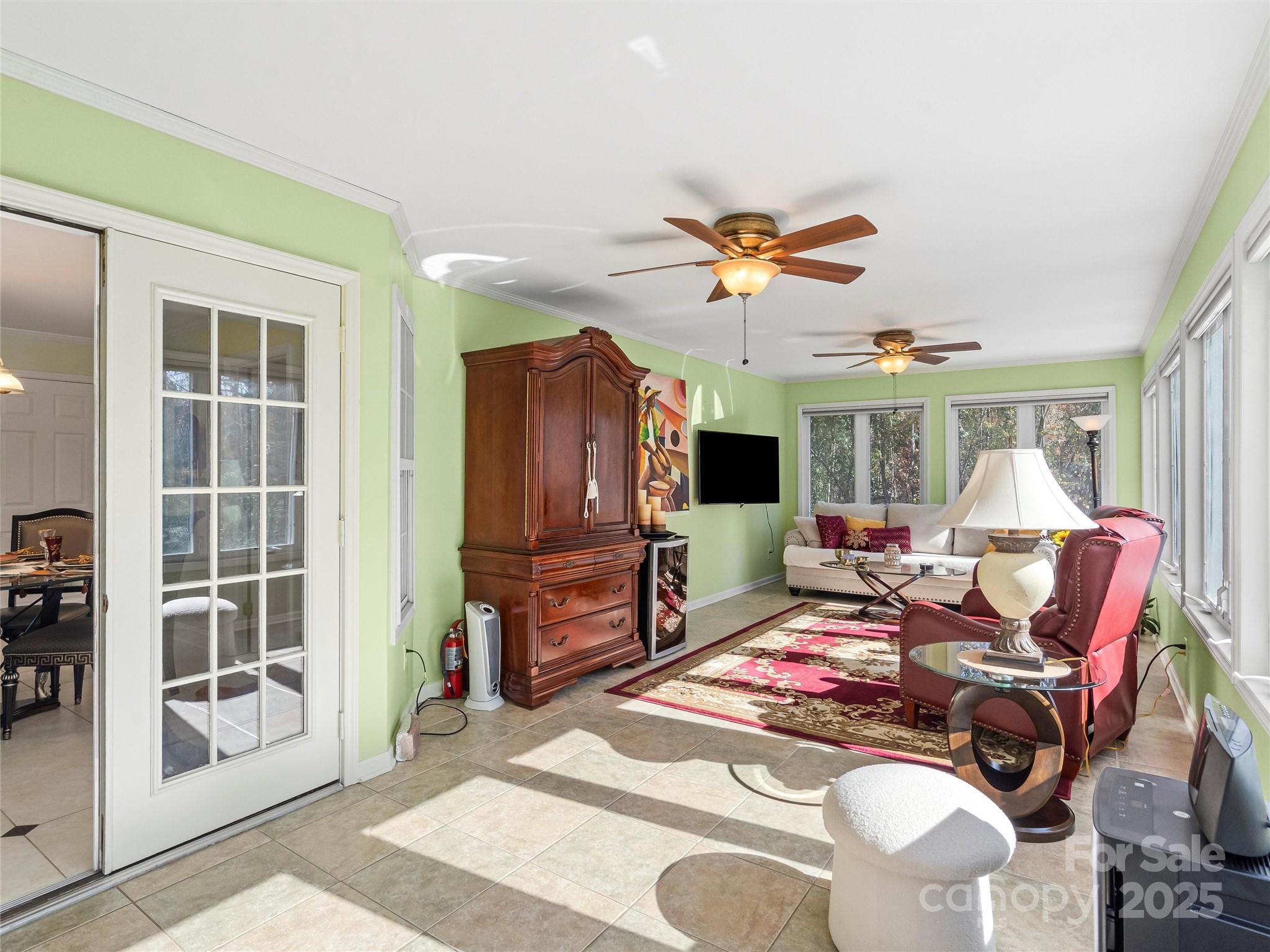 1002 4th Street Northeast Conover, NC 28613 - Photo 28 of 47 a living room with furniture a flat screen tv and a large window
