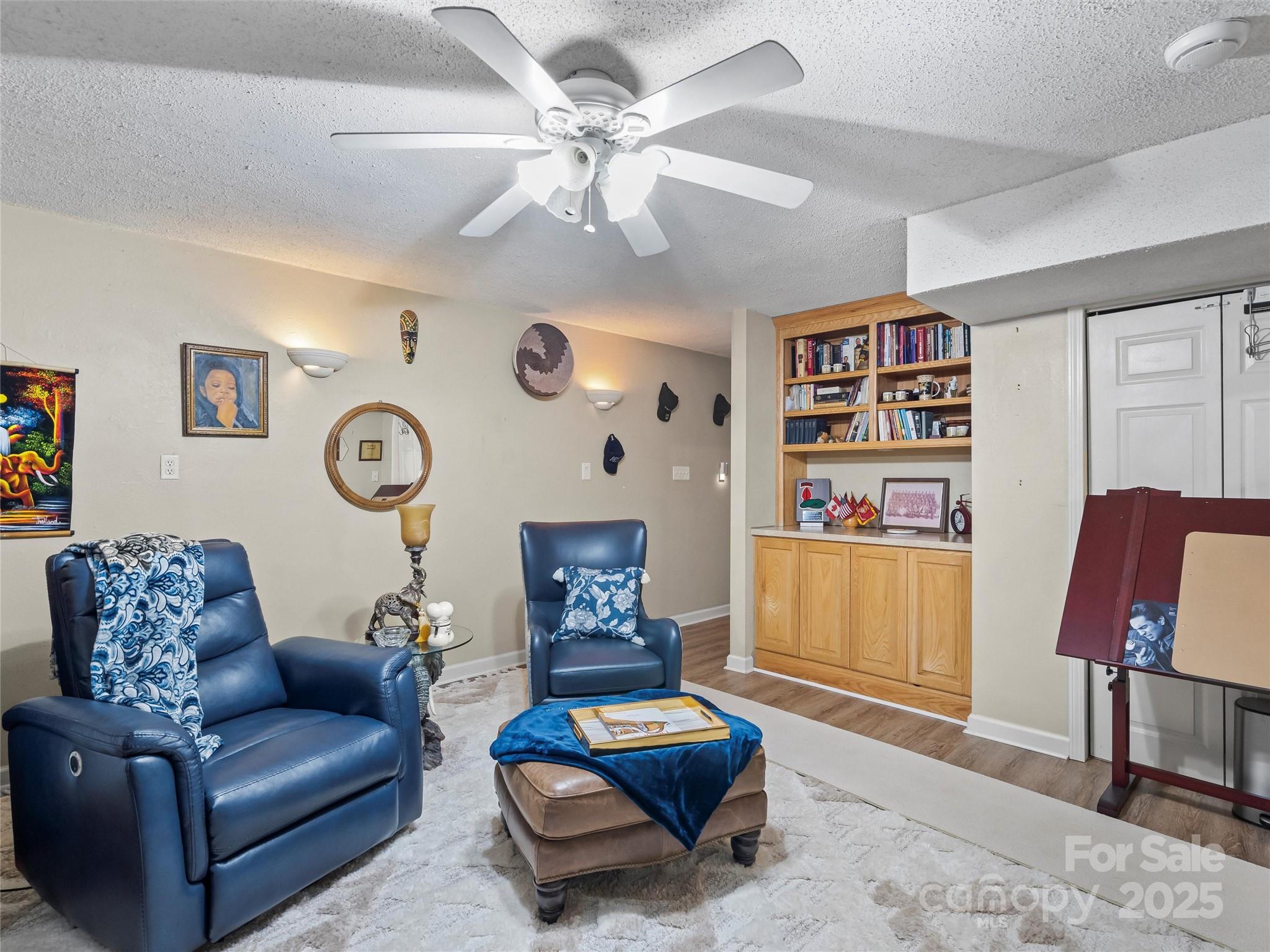 1002 4th Street Northeast Conover, NC 28613 - Photo 31 of 47 a living room with furniture and a chair
