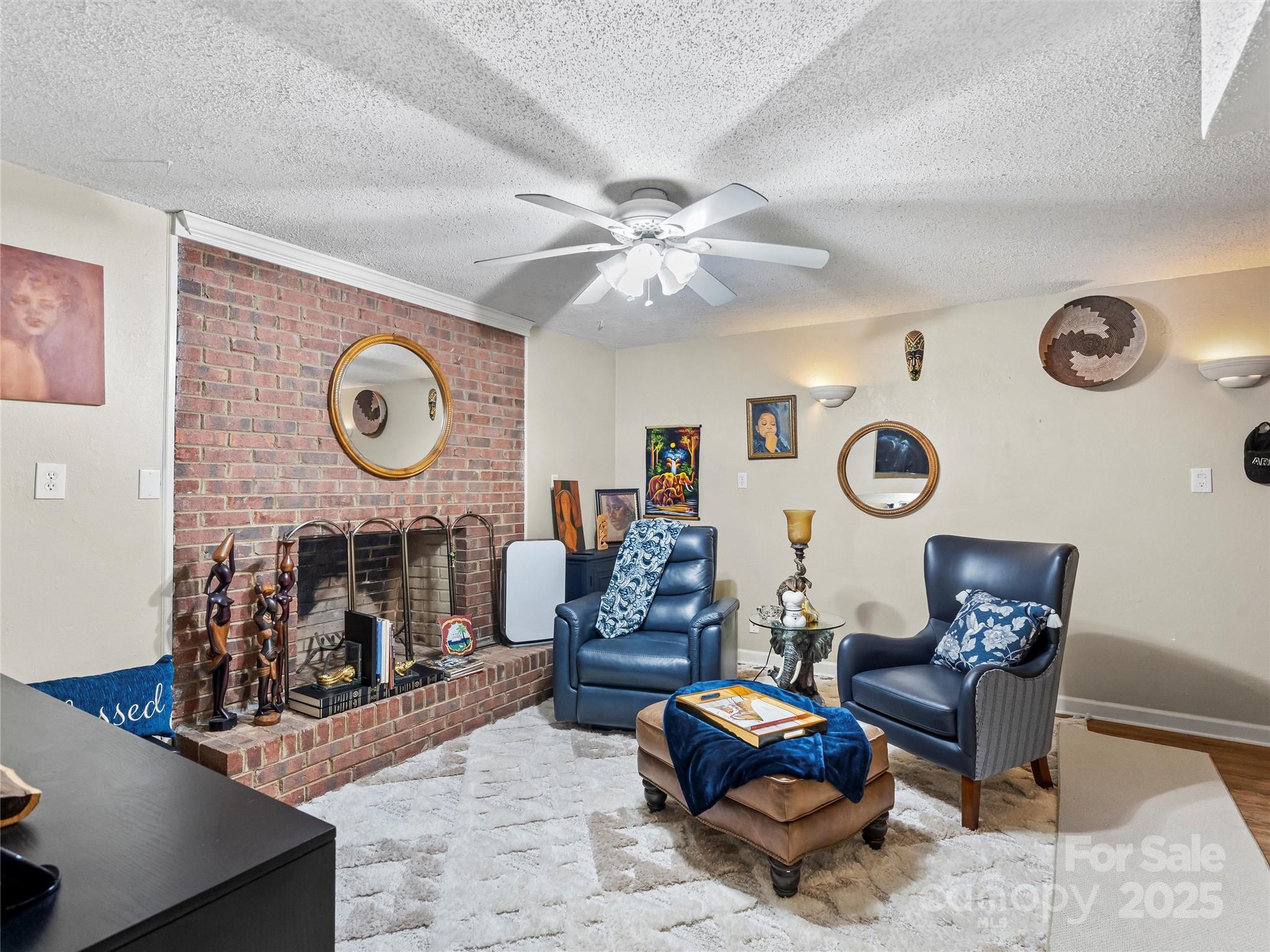 1002 4th Street Northeast Conover, NC 28613 - Photo 32 of 47 a living room with furniture a clock and a large window