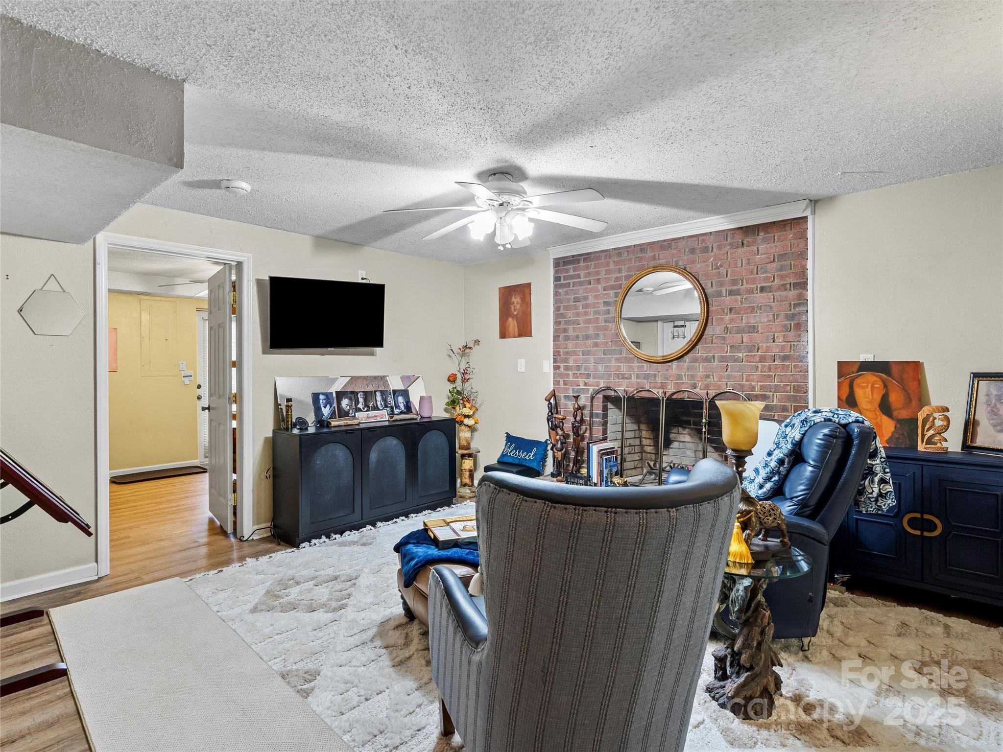 1002 4th Street Northeast Conover, NC 28613 - Photo 33 of 47 a living room with furniture and a flat screen tv
