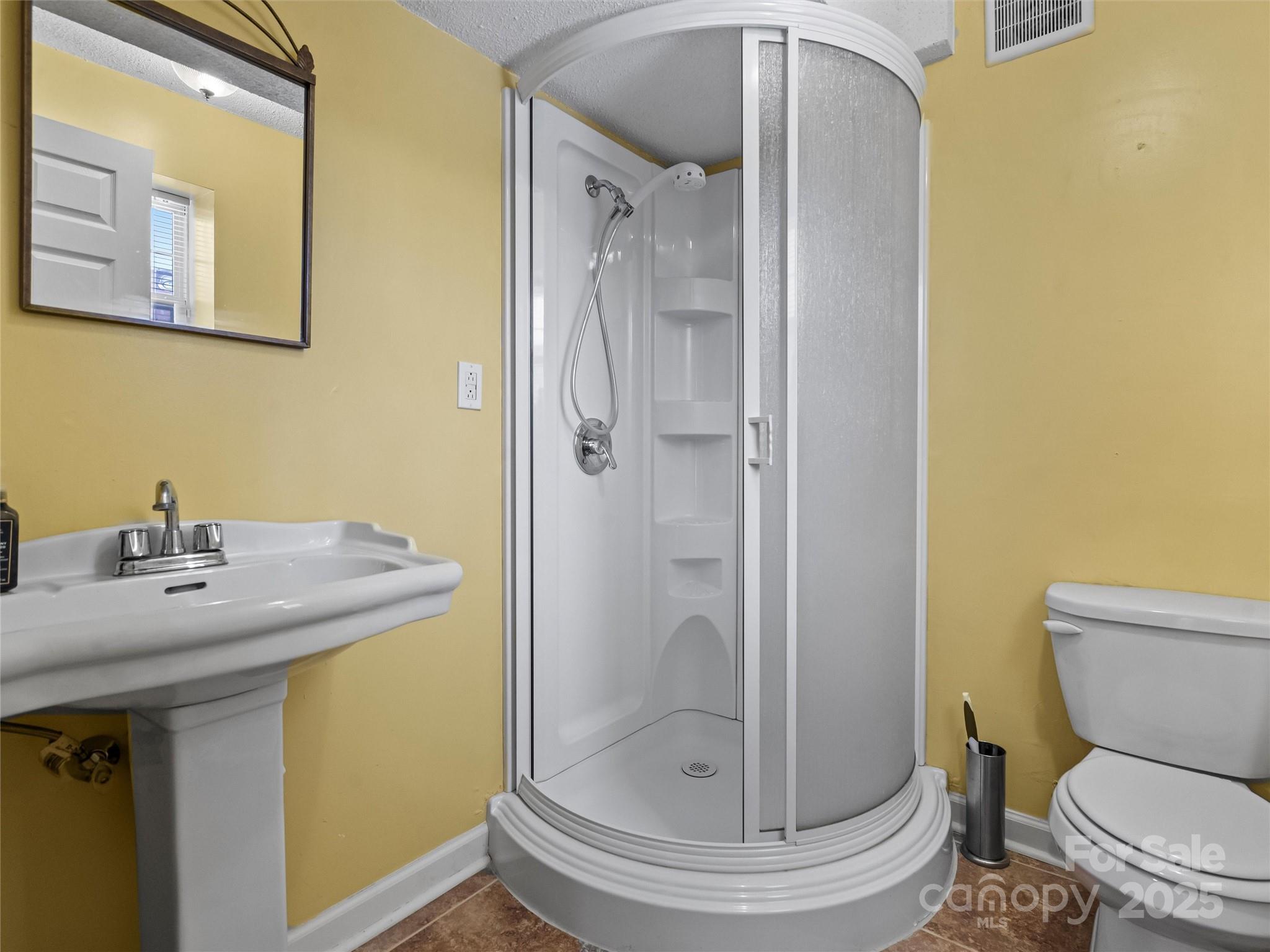 1002 4th Street Northeast Conover, NC 28613 - Photo 36 of 47 a bathroom with a granite countertop toilet sink and shower