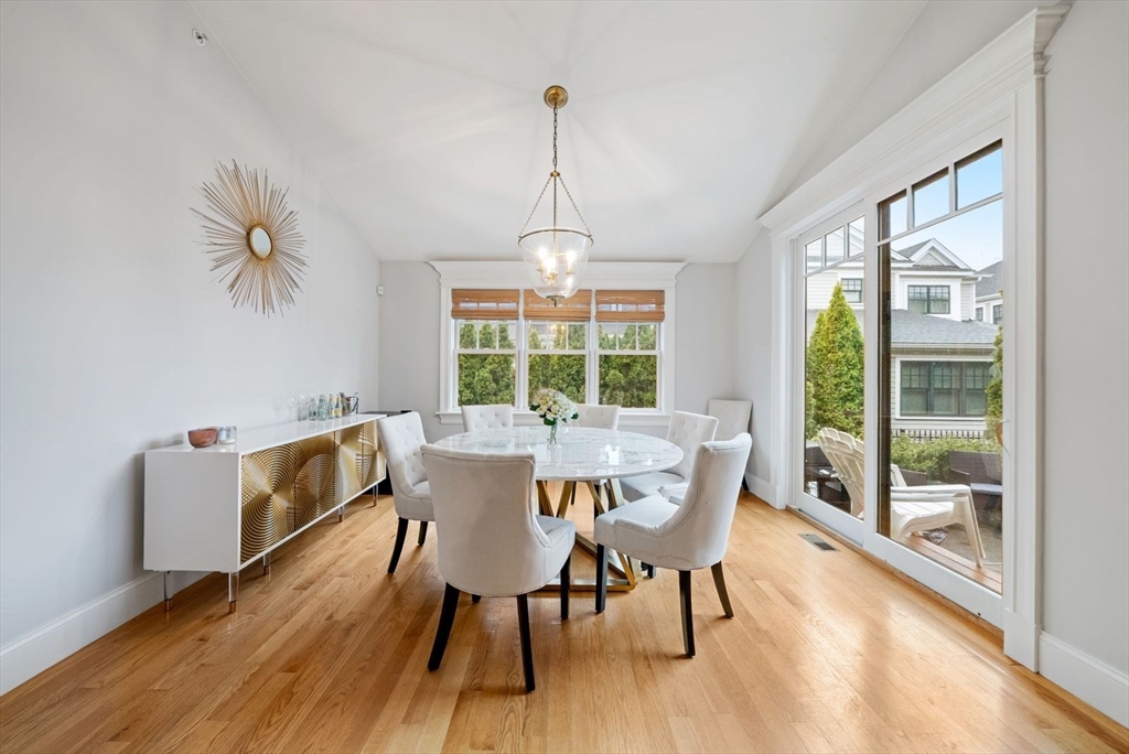 21 Lillian Way, Unit 21 Wayland, MA 01778 - Photo 12 of 33 a view of a dining room with furniture window and wooden floor