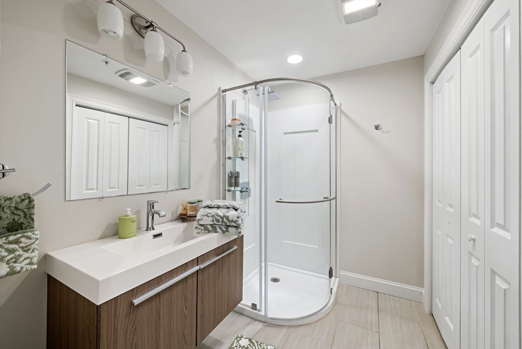 21 Lillian Way, Unit 21 Wayland, MA 01778 - Photo 19 of 33 a bathroom with a sink a toilet and shower