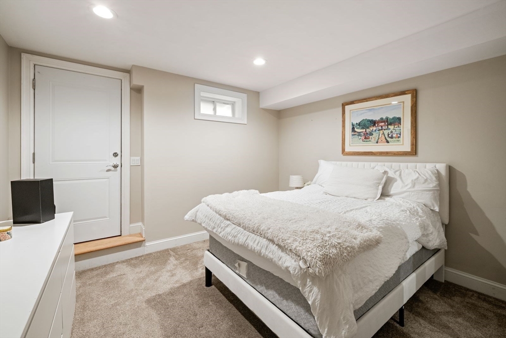 21 Lillian Way, Unit 21 Wayland, MA 01778 - Photo 27 of 33 a large white bed in a white room