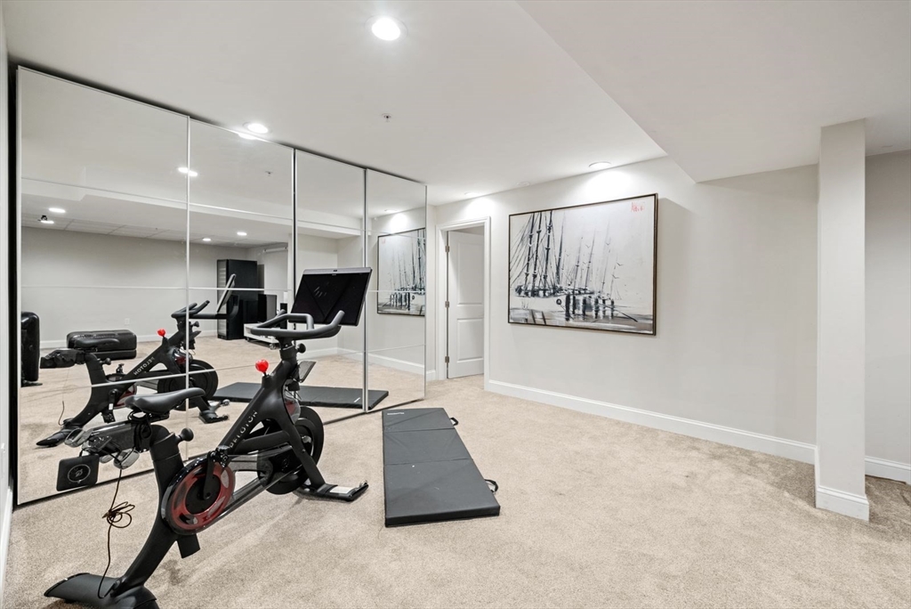 21 Lillian Way, Unit 21 Wayland, MA 01778 - Photo 31 of 33 a view of a room with gym equipment