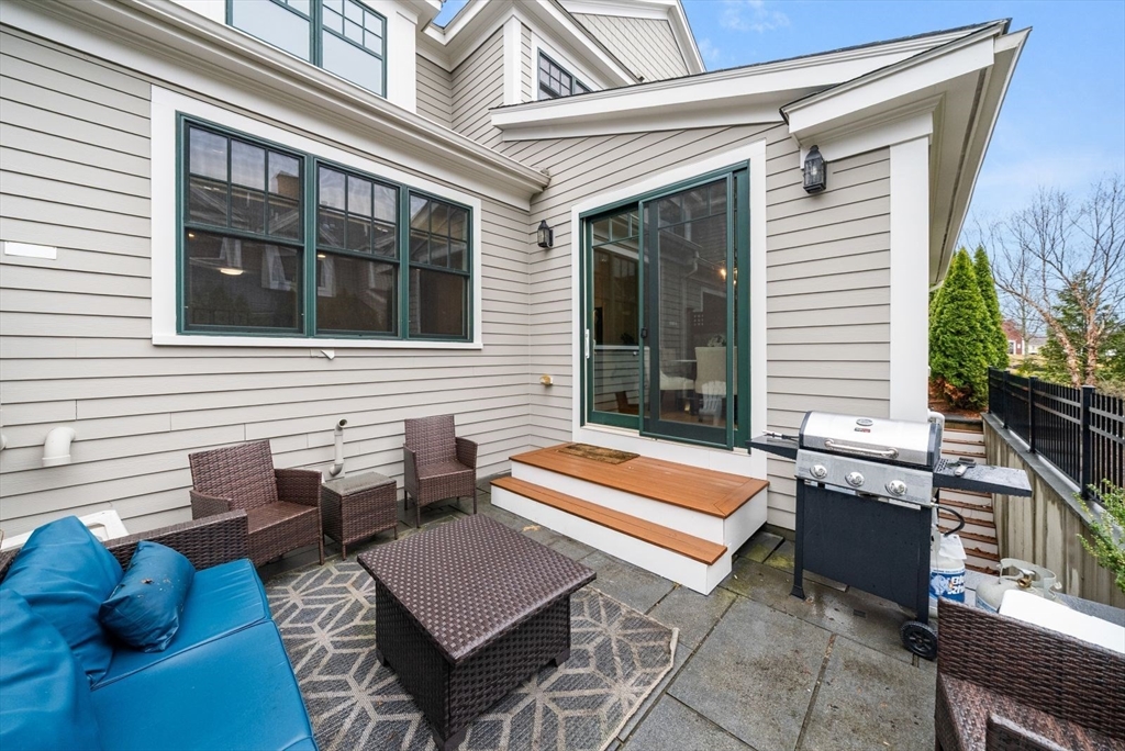 21 Lillian Way, Unit 21 Wayland, MA 01778 - Photo 32 of 33 a building outdoor space with patio furniture