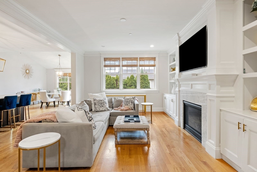 21 Lillian Way, Unit 21 Wayland, MA 01778 - Photo 8 of 33 a living room with fireplace furniture and a flat screen tv