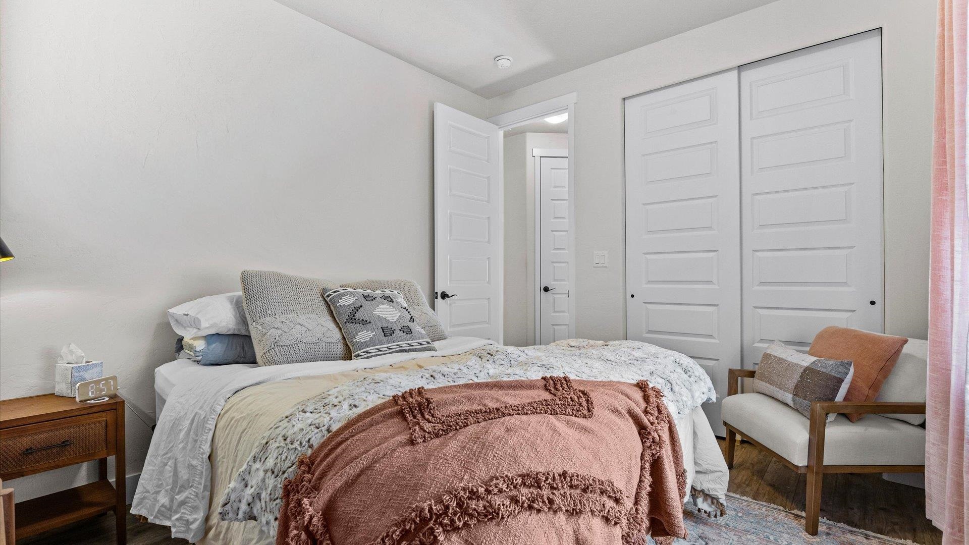 840 Rupp Avenue Palisade, CO 81526 - Photo 19 of 27 a bed sitting in a bedroom next to a chair