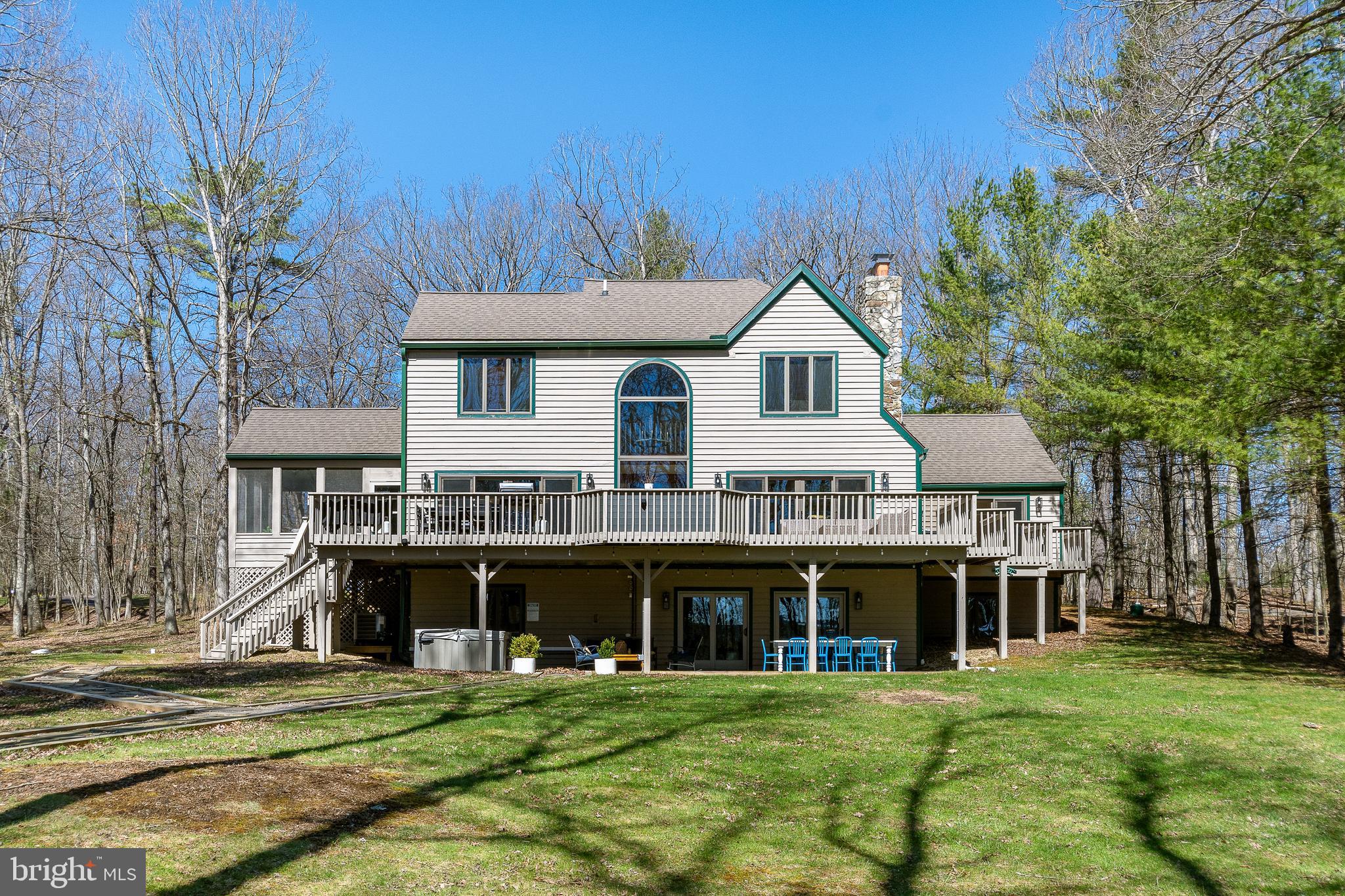1038 South Blakeslee Road Oakland, MD 21550 - Photo 4 of 69 a front view of a house with a garden