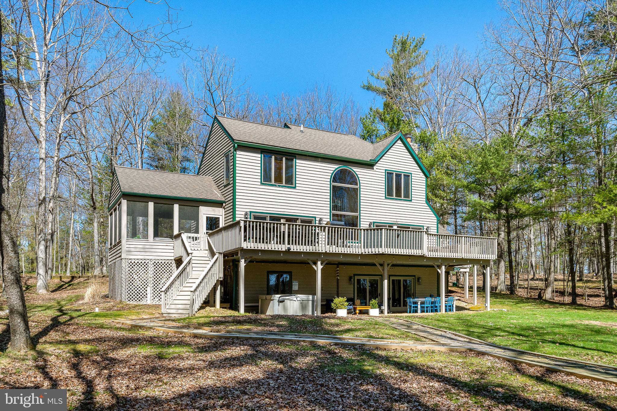 1038 South Blakeslee Road Oakland, MD 21550 - Photo 56 of 69 a front view of a house with a yard