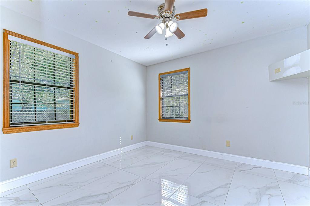 16349 Spring Valley Road Dade City, FL 33523 - Photo 29 of 40 a view of an empty room with a window