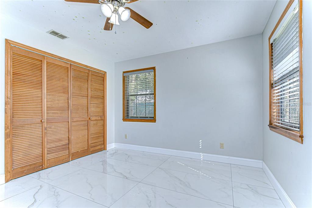 16349 Spring Valley Road Dade City, FL 33523 - Photo 30 of 40 a view of an empty room with a window
