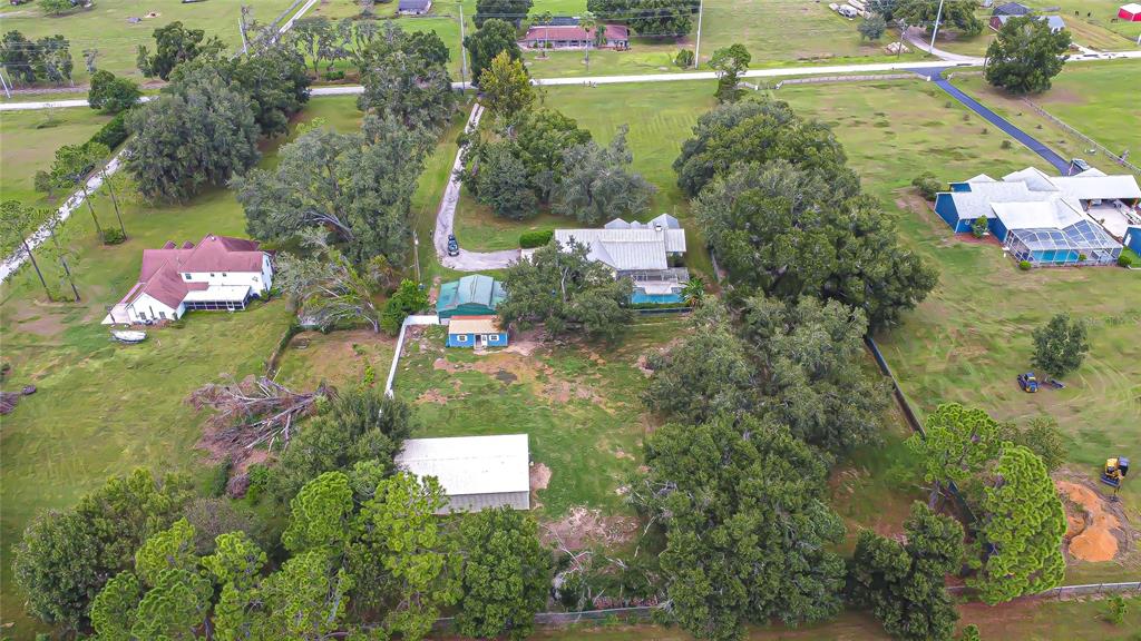 16349 Spring Valley Road Dade City, FL 33523 - Photo 38 of 40 an aerial view of a house with a yard